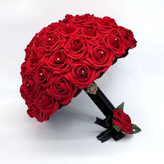 Red bridal bouquet made with real touch roses. Handle is made using black satin ribbon finished with a gold brooch and bling wrap. matching red boutonniere with black ribbon
