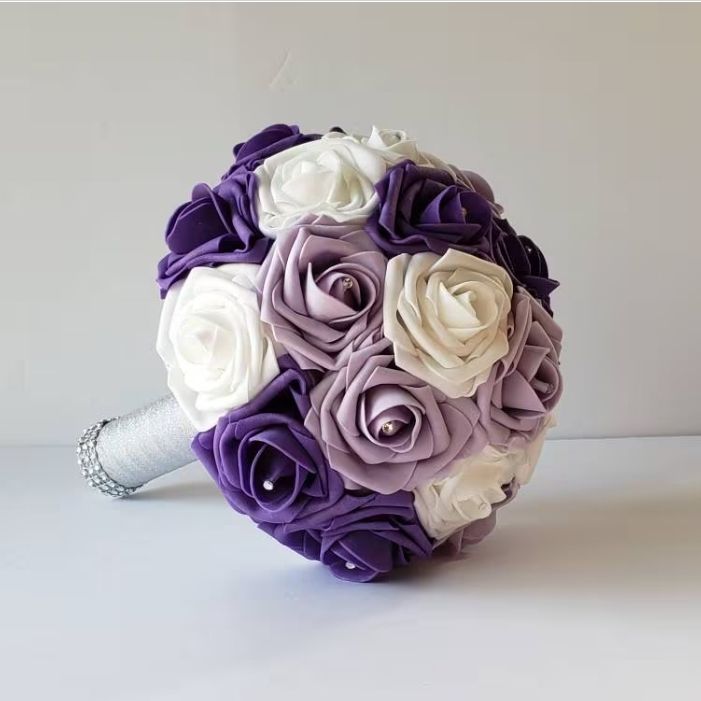 Purple, Lavender, Lilac, and white bouquet made with Real touch roses.and silver handle