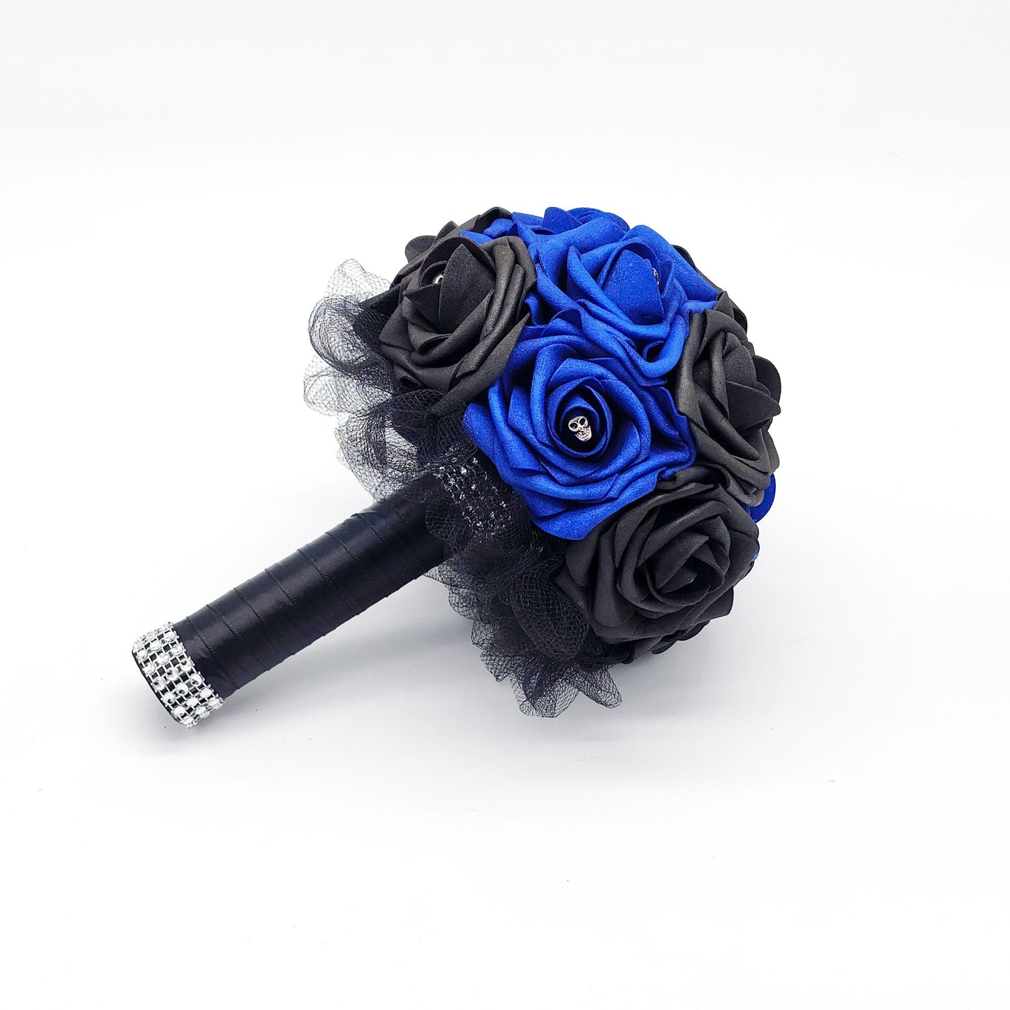 royal blue and black gothic skull bridal bouquet. made with real touch roses. black tulle and ribbon are covering the handle. silver skulls are scattered throughout
