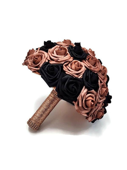 Dusty Rose and Black Wedding Bouquet Made With Real Touch Roses. Rhinestones are in the center of every rose. handle is made out of rose gold ribbon and finished with rose gold bling wrap.