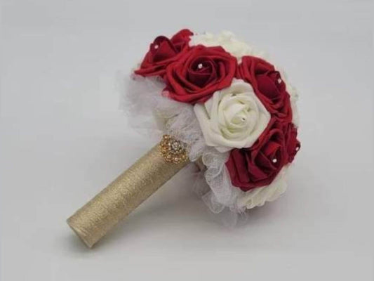 Red and ivory wedding bouquet made with real touch roses. 