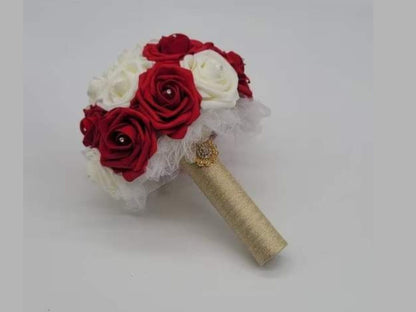 Red and ivory wedding bouquet made with real touch roses. 