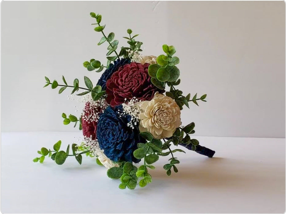 Burgundy, Navy, and White Blue Sola Flower Bouquet with frosted eucalyptus greenery and navy ribbon