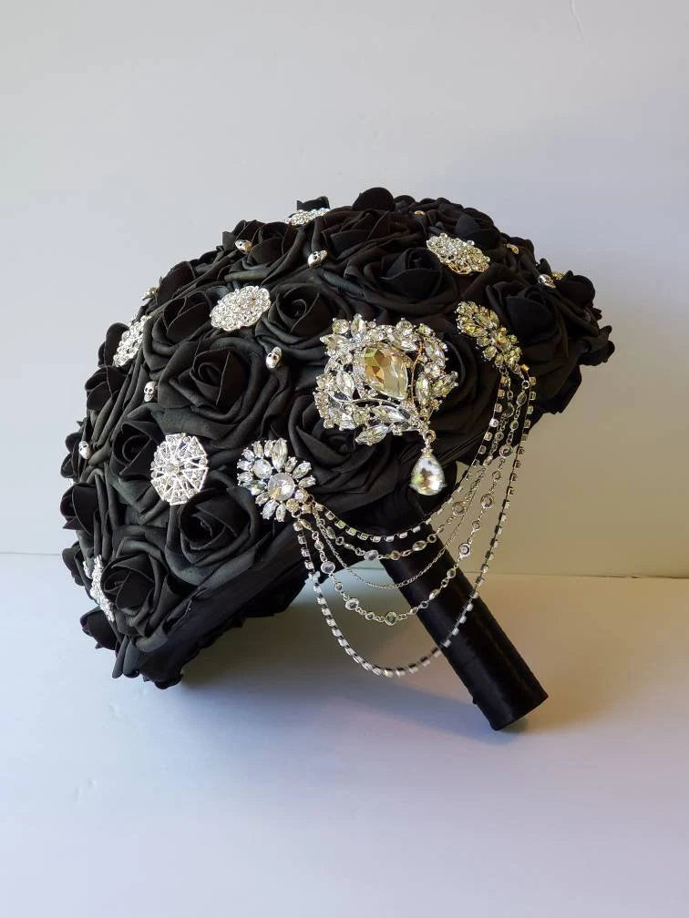 black bridal bouquet with silver brooches and skulls, silver cascading chains
