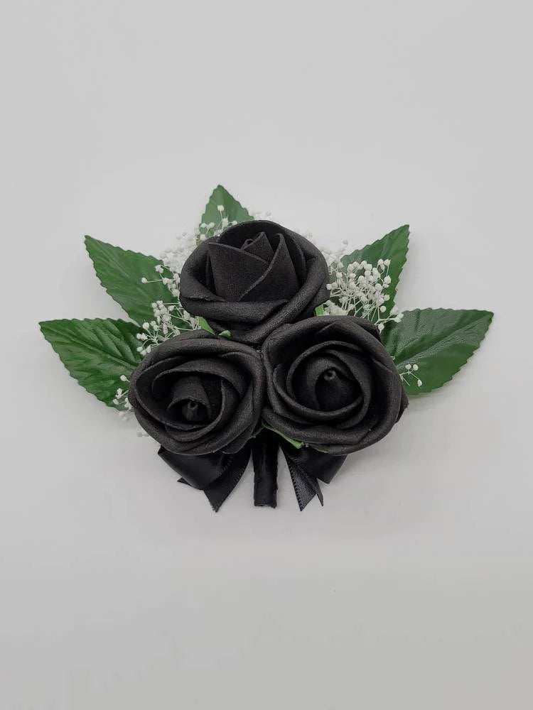 all black pin on corsage with babies breath