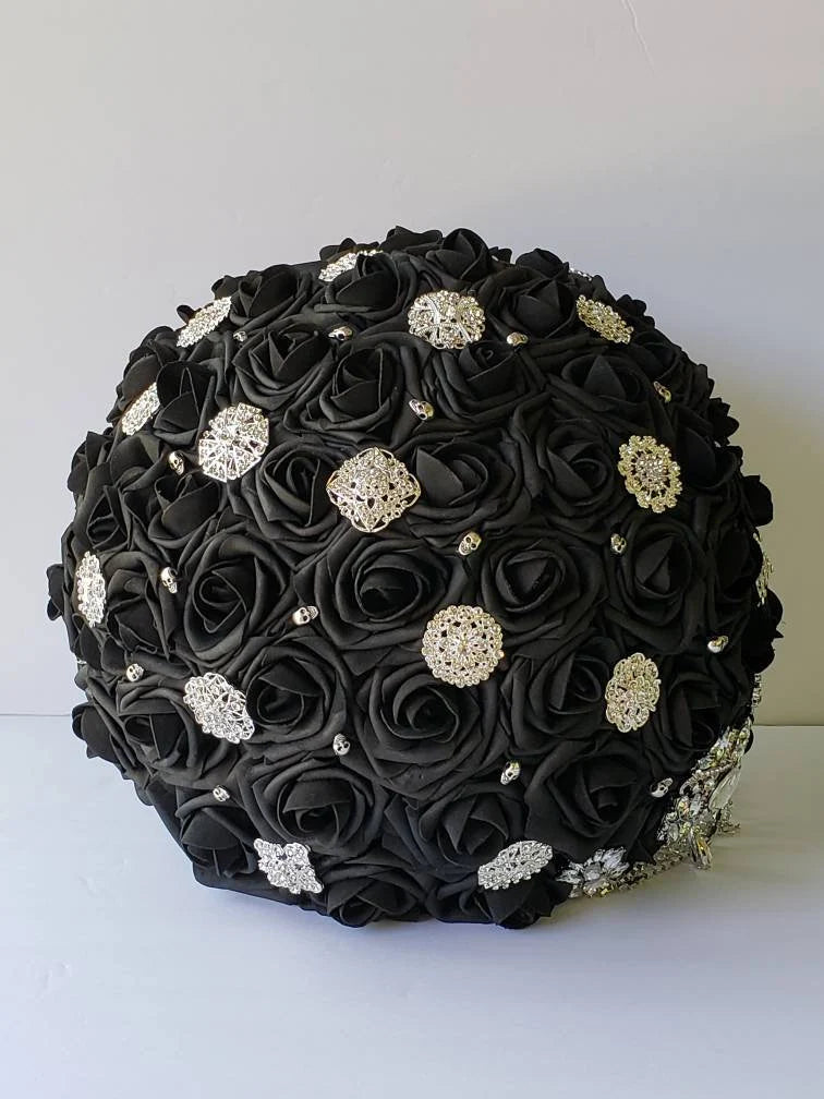 black bridal bouquet with silver skulls and brooches