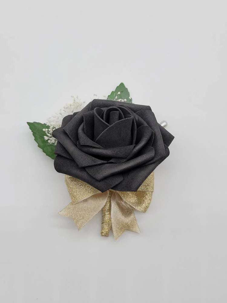 black and gold boutonniere made with real touch roses, with babies breath