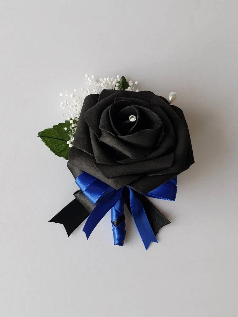 black boutonniere with babies breath and black and blue french twist ribbon handle