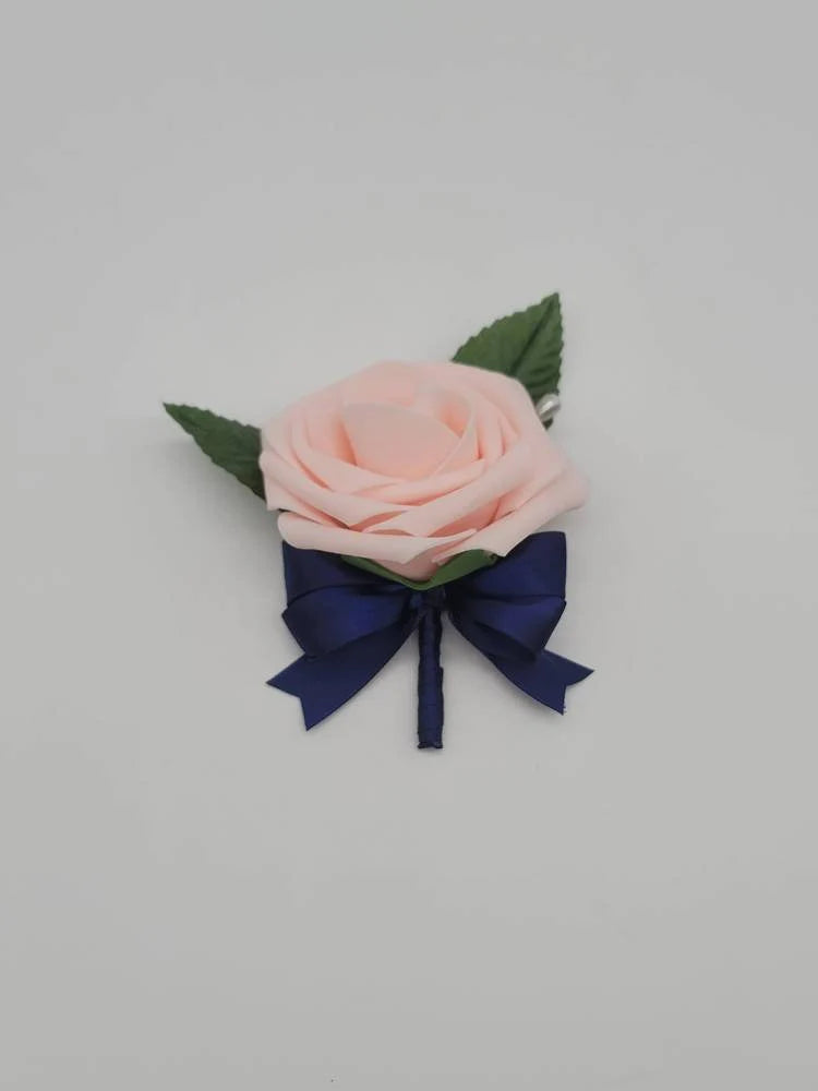 blush and navy boutonniere made with real touch roses