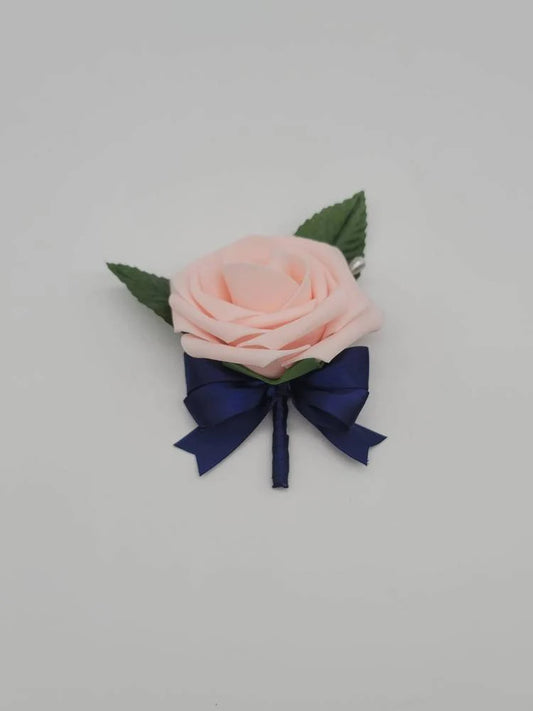 blush and navy boutonniere made with real touch roses