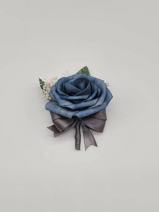 dusty blue and grey boutonniere with babies breath