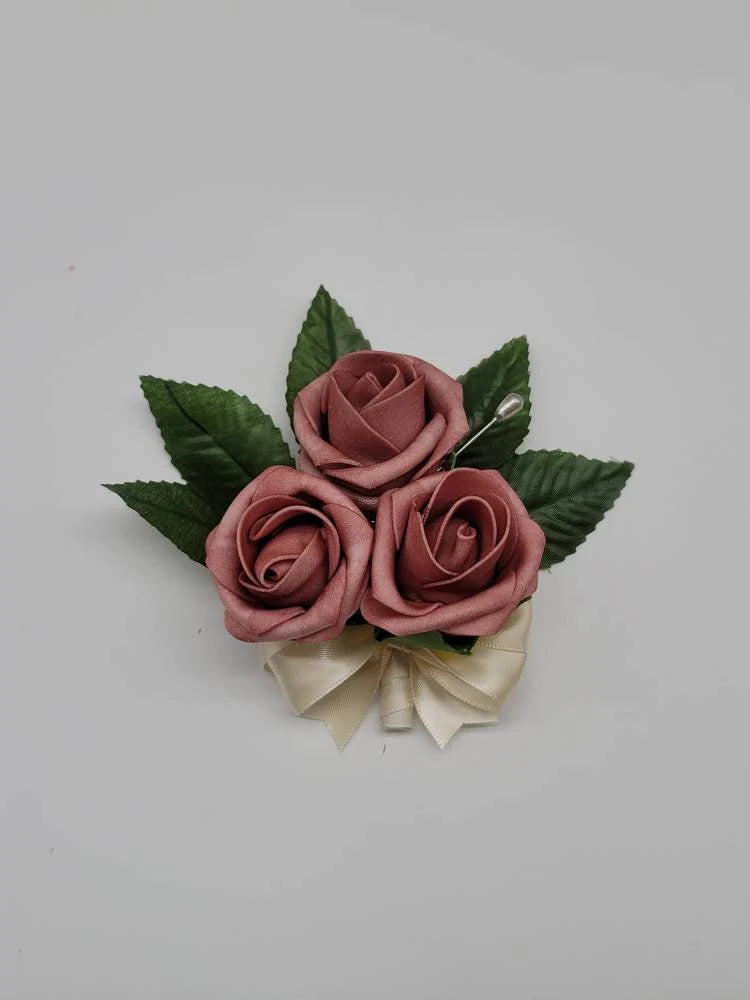 dusty rose and ivory pin on corsage