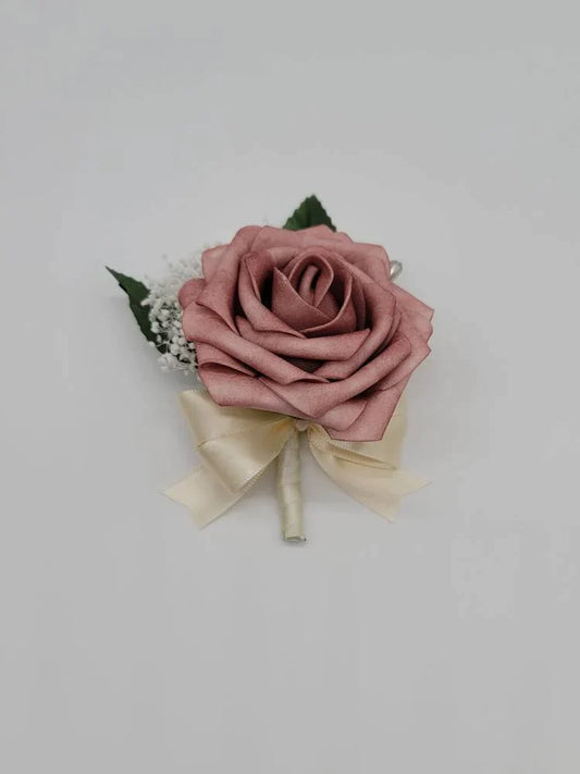 dusty rose and ivory boutonniere with babies breath
