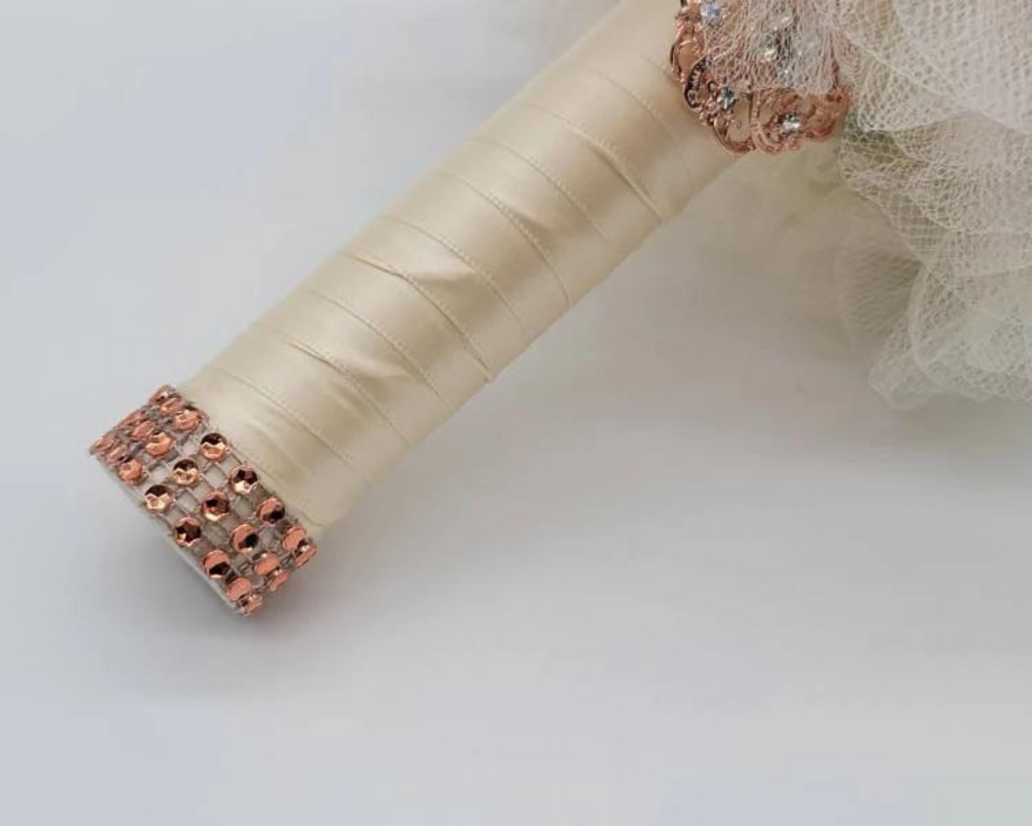ivory handle with rose gold brooch and rose gold bling wrap