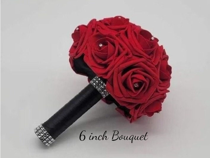 6 inch tossing bouquet made with red rose and black satin handle. 