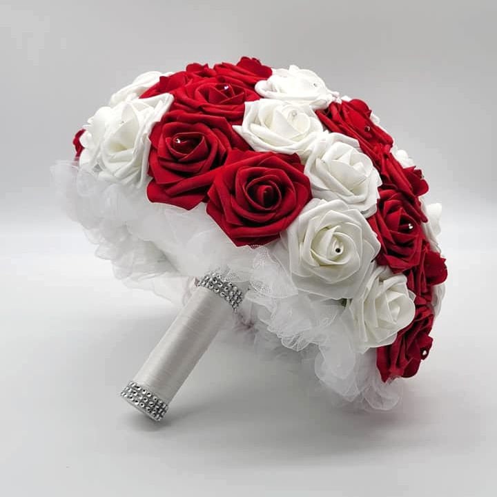 Red And White Wedding Bouquet Made With Real Touch Roses. Rhinestones on every rose. Handle is made using white tulle, white satin ribbon, and finished with silver bling wrap. 