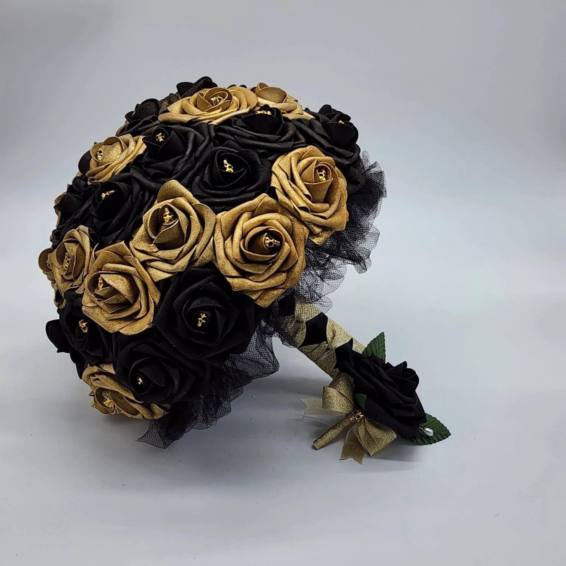 black and gold gothic skull bridal bouquet and boutonniere