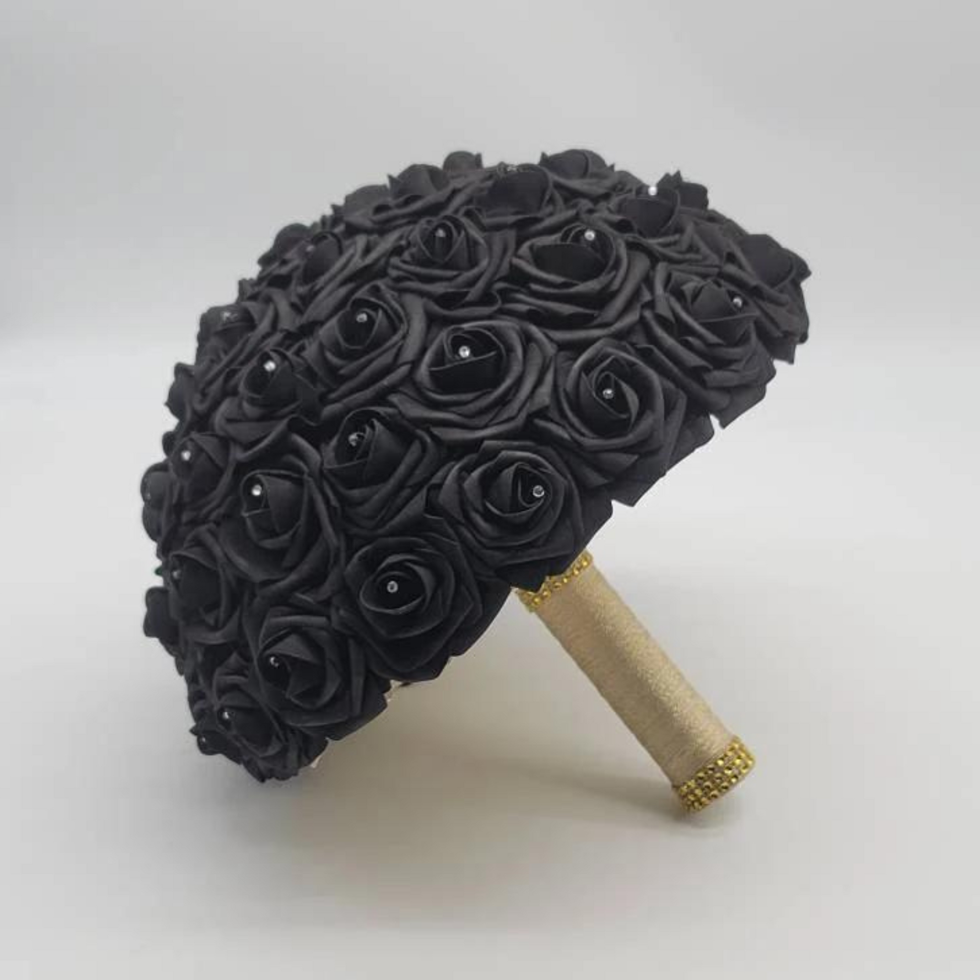 black real touch roses bridal bouquet with gold ribbon and gold bling wrap.